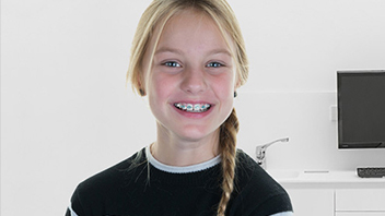 About Smiles Dental Centres - Toddler wearing braces